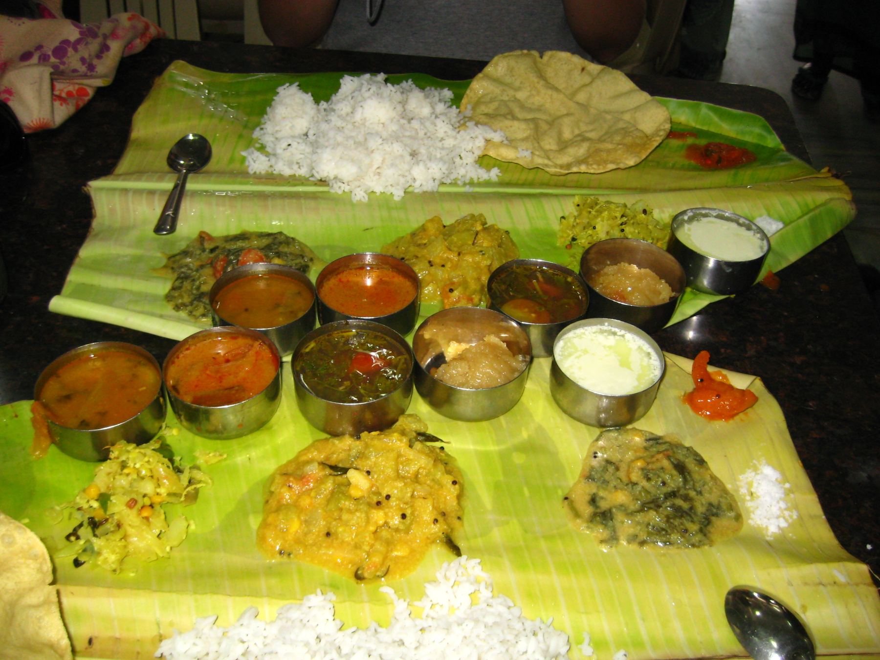 Placeholder photo: a traditional South Indian meal served on a banana leaf with an assortment of small steel bowls — to be replaced with Garuda's own photography